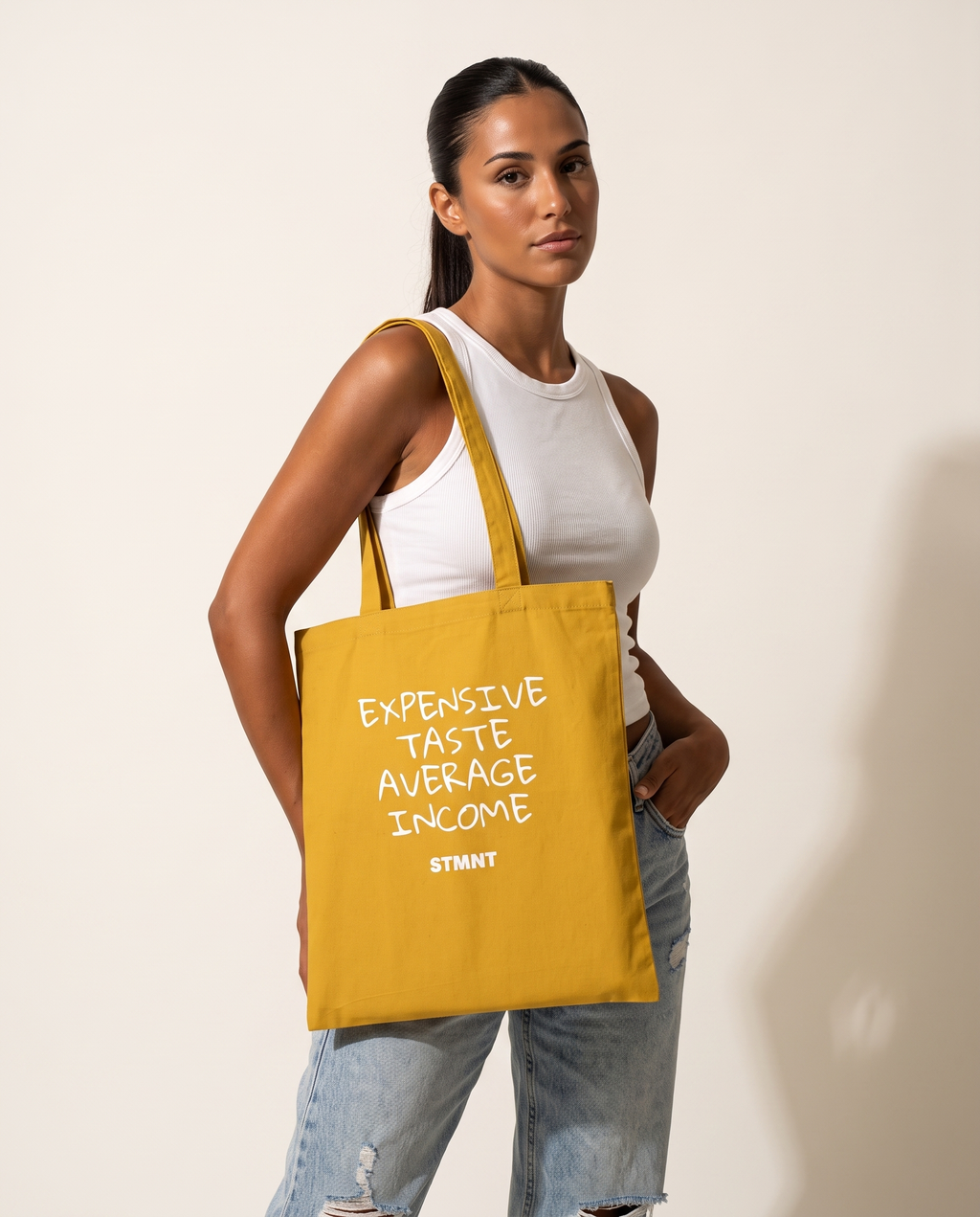 Expensive Taste Tote Bag carried by model