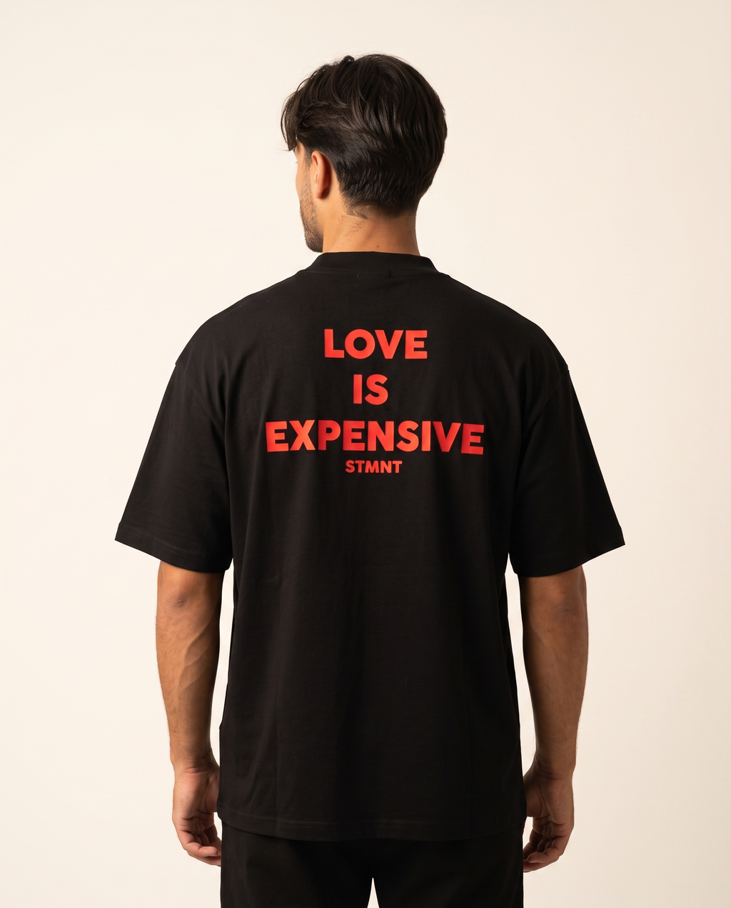 Love Is Expensive Oversized T-Shirt worn by model