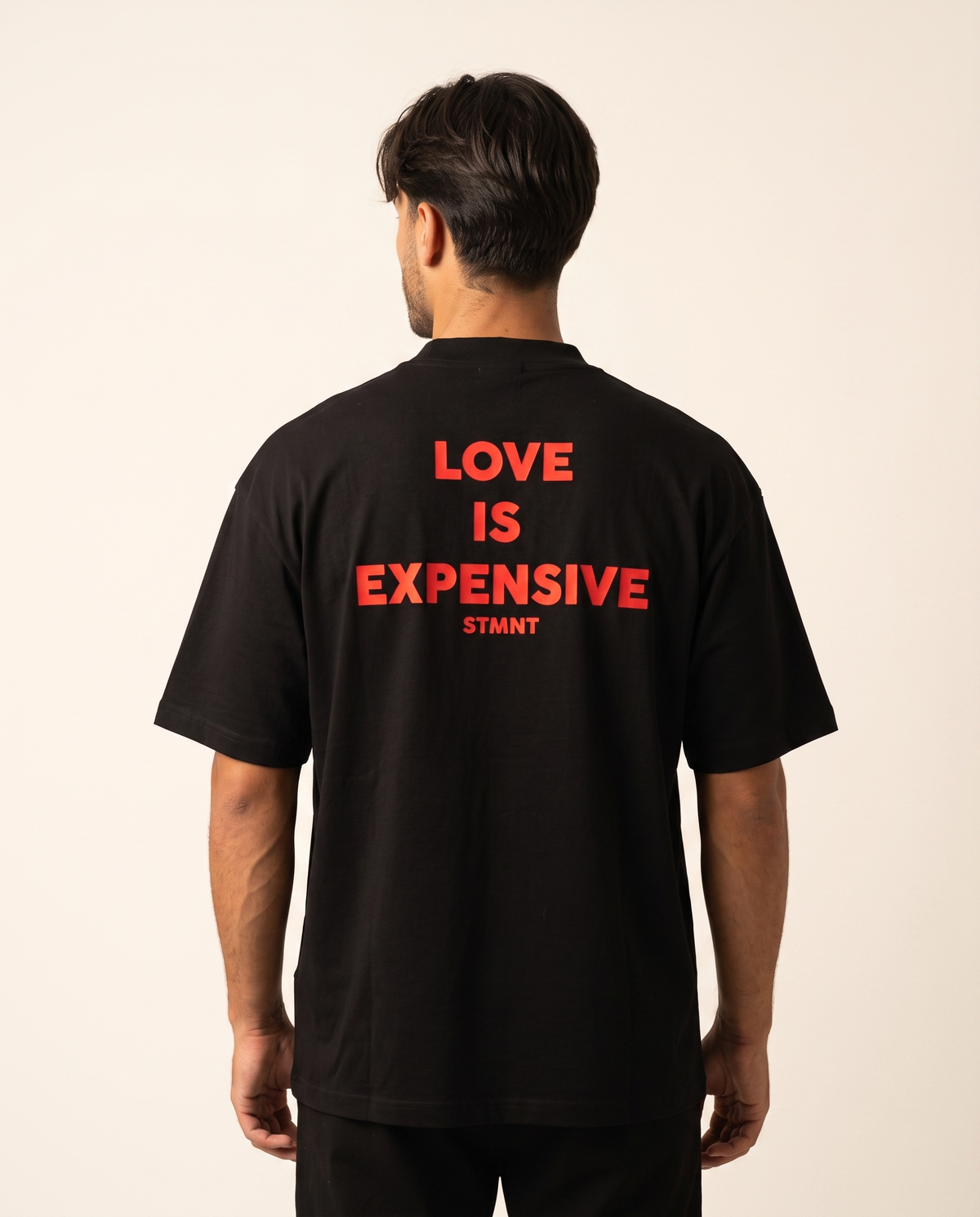 Love Is Expensive Oversized T-Shirt worn by model