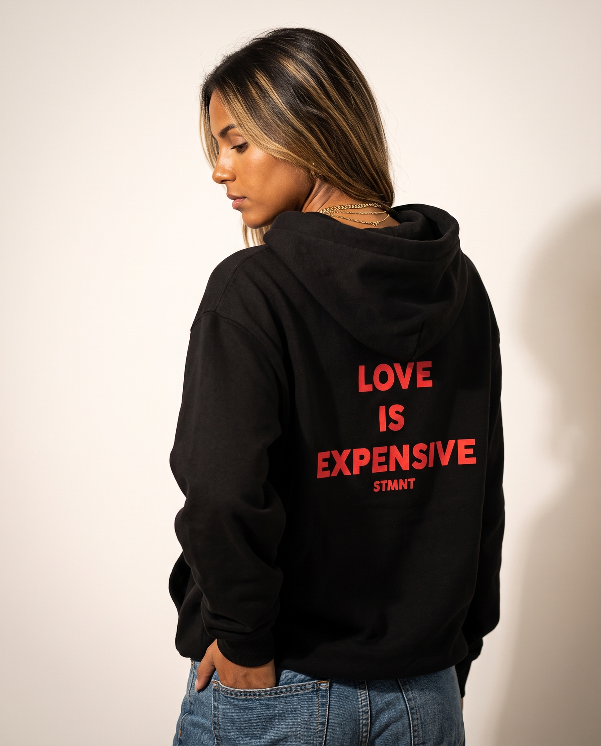 Love Is Expensive Oversized Hoodie worn by model