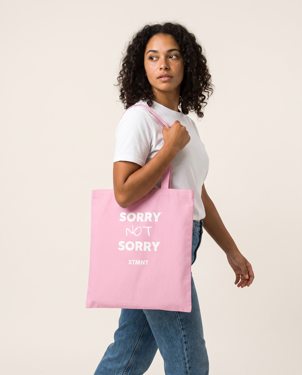Sorry Not Sorry Tote Bag carried by model